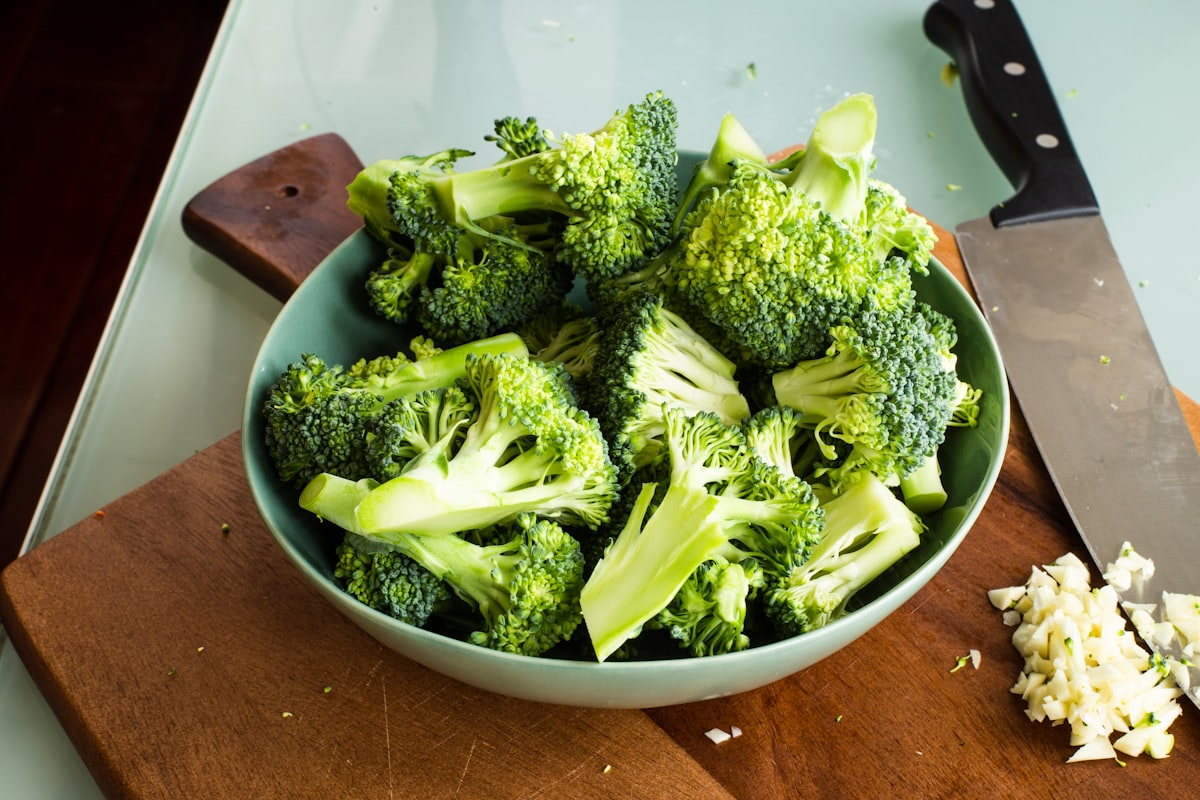 Steaming broccoli and green vegetables in a bamboo steamer basket